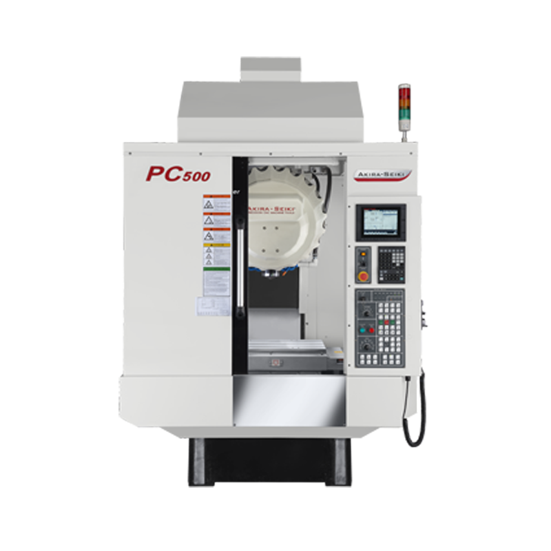 Akira Seiki's PC500 Tapping Center is highlighted in the image. This machining center boasts a sturdy build and precise engineering, ideal for high-performance tapping operations. The image captures its advanced features, reflecting efficiency and technological prowess in machining.