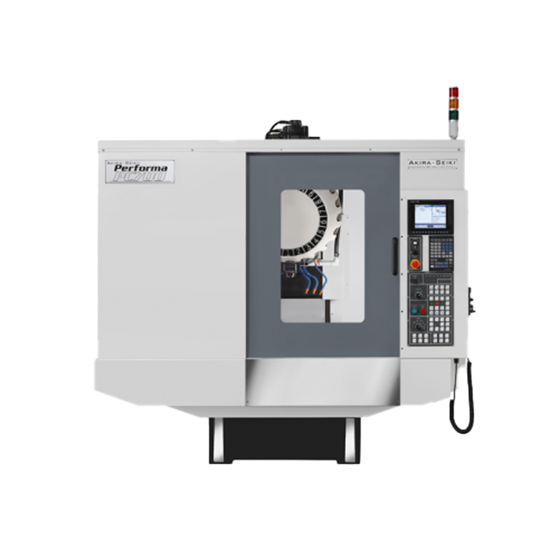 Akira Seiki's PC700 Tapping Center is shown in the image. The machine appears robust with a metallic frame and various components. It features a vertical design optimized for tapping operations, with a spindle and tooling visible at the top. Control panels and indicators suggest user-friendly operation and precise control. Overall, it embodies efficiency and capability in precision tapping applications.